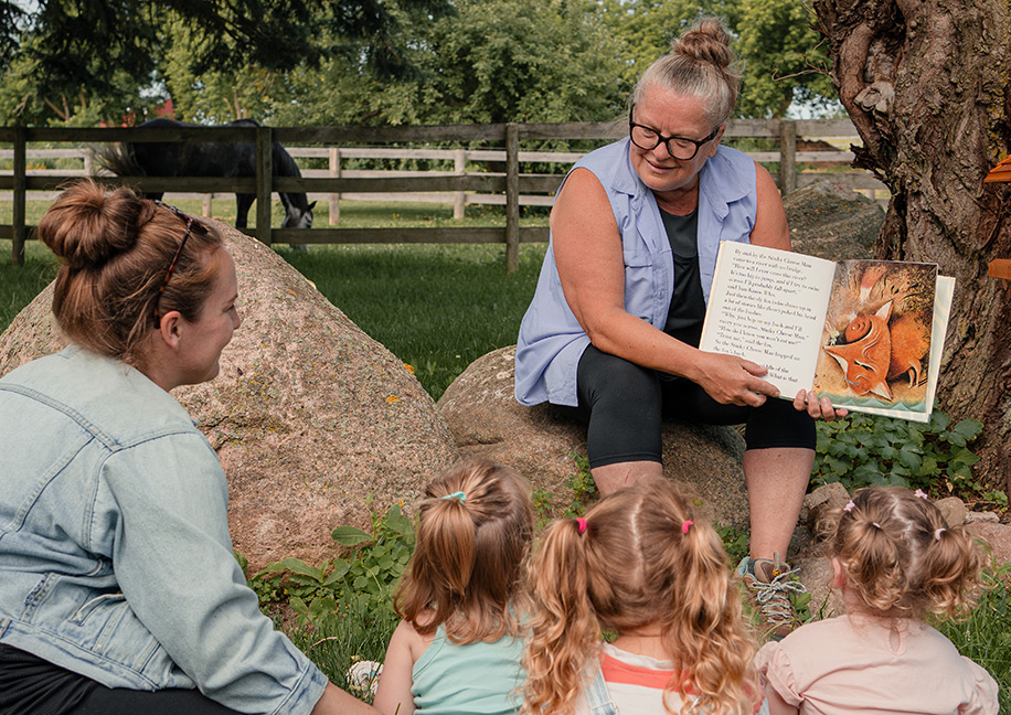 Parents connecting and bonding with their children at Barn Yard Buddies community farm event